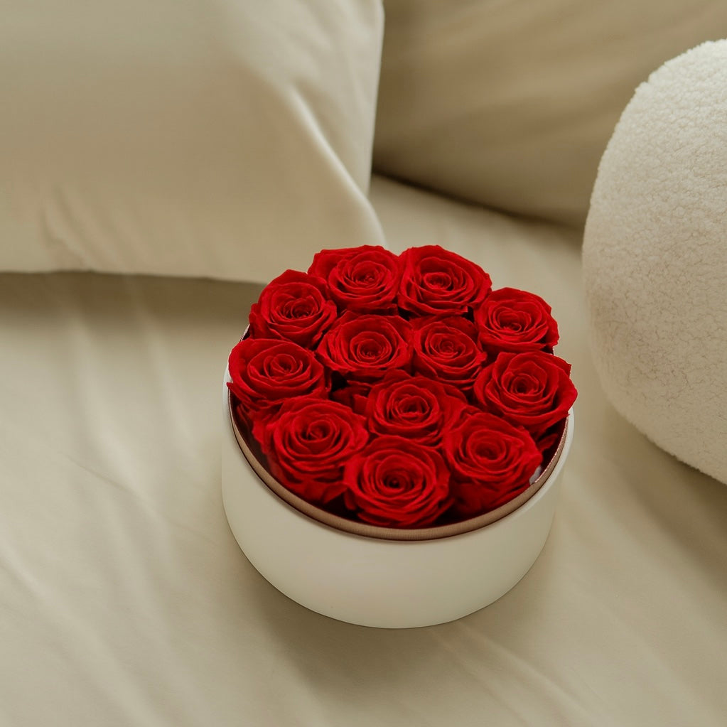 Box of red preserved roses, real flowers compared to artificial alternatives