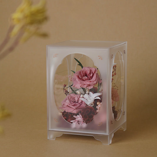 Pink flower arrangment in Acrylic Display box