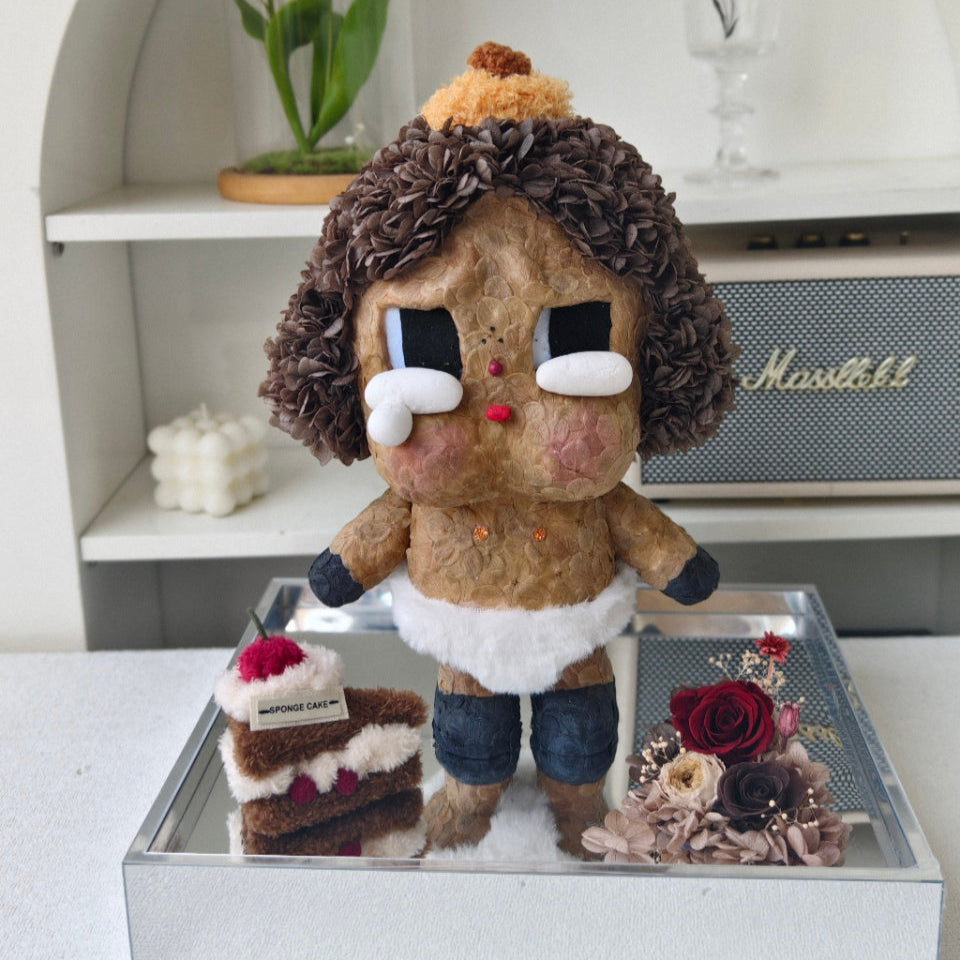 Flower Crybaby-baby brown with a cake and flowers on a reflective surface, with a Marshall amplifier in the background.