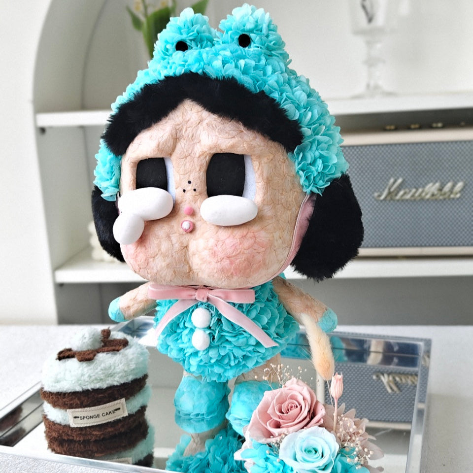 Flower Crybaby-what a frog with turquoise hair and outfit on a reflective surface