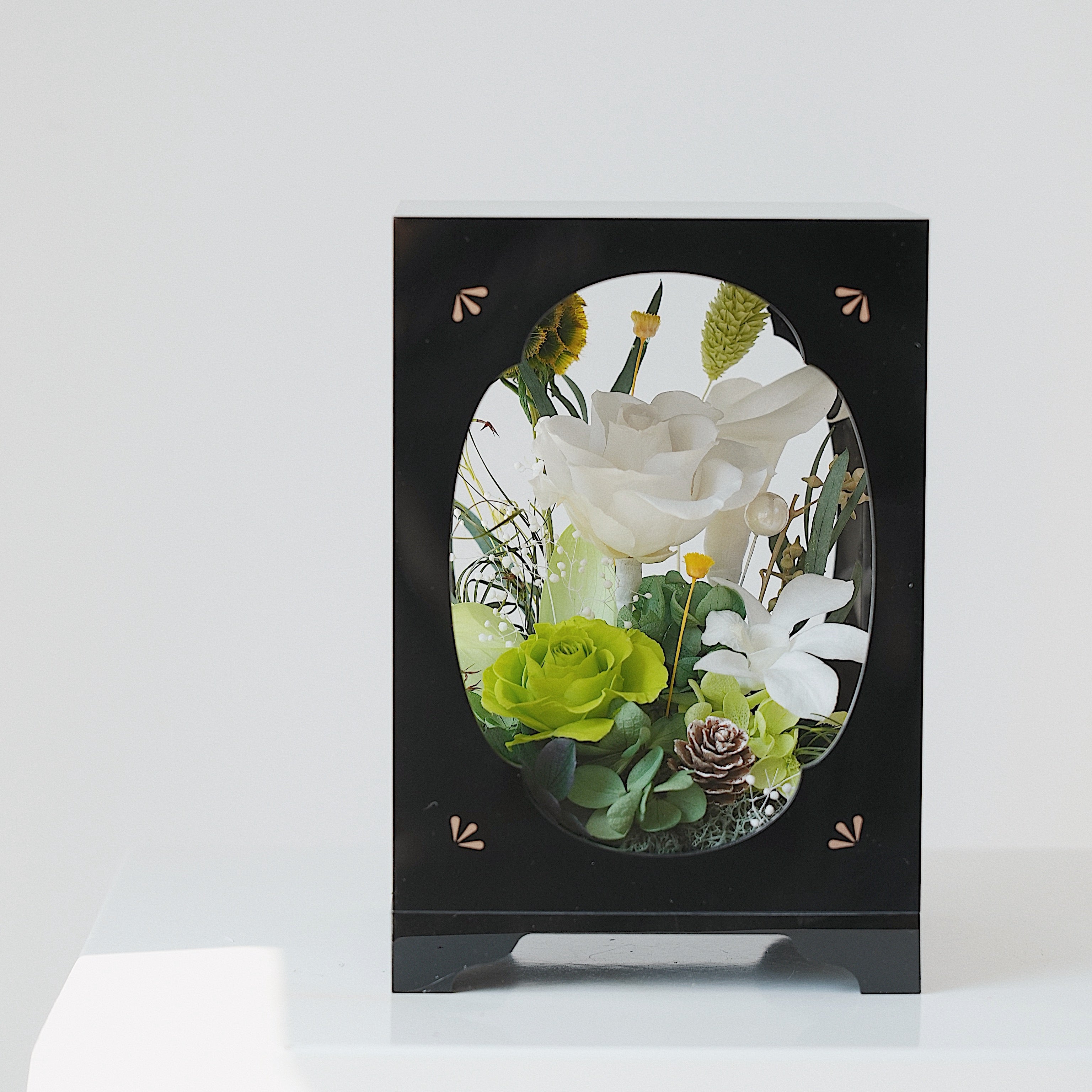 Decorative frame with preserved flowers on a white background
