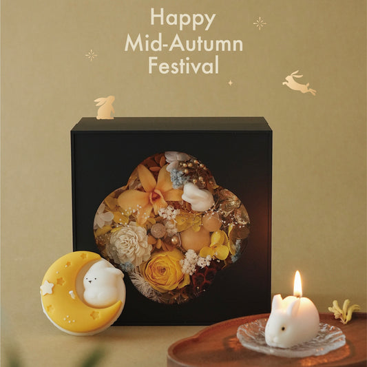 Decorative floral arrangement in a black box with 'Happy Mid-Autumn Festival' text on a beige background.