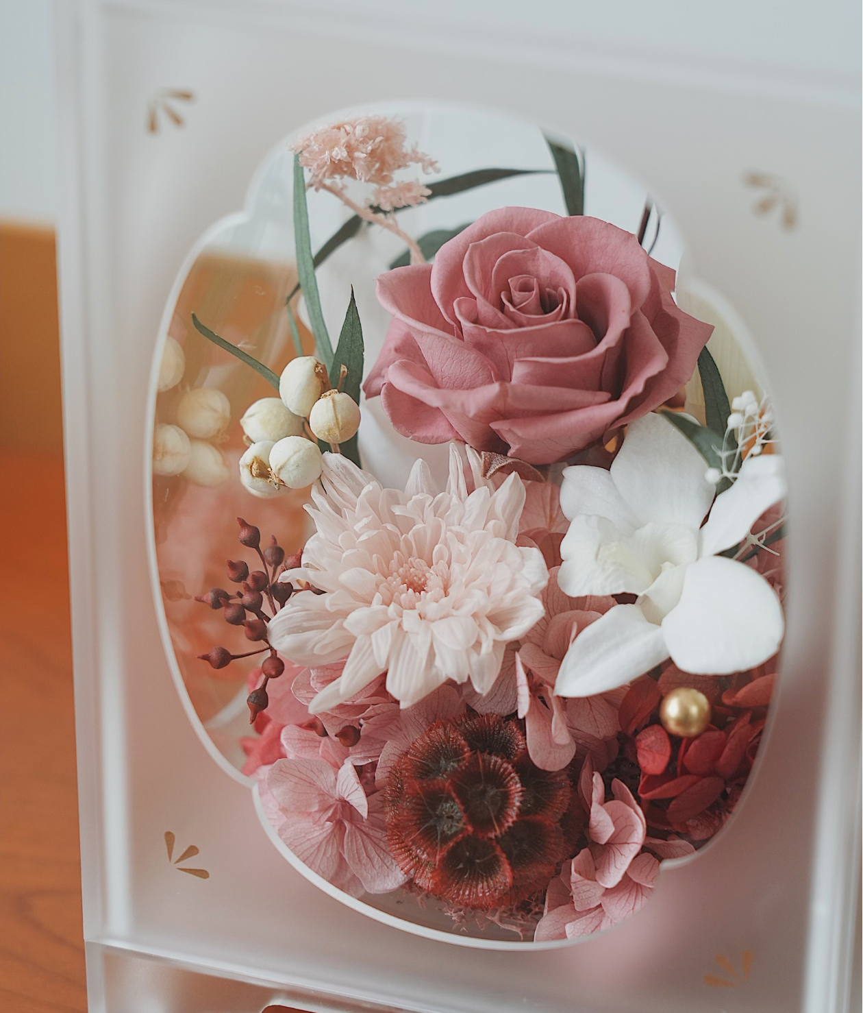 Acrylic with pink and white flowers on a wooden surface
